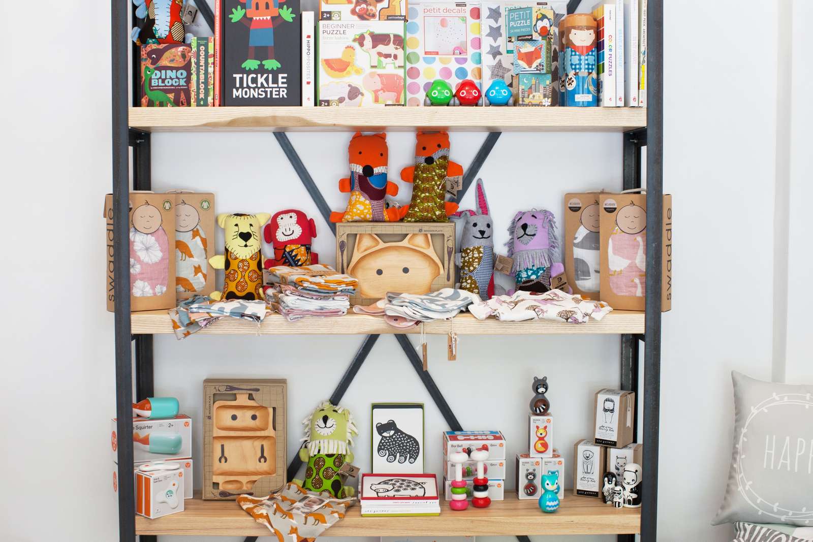 Shelf with unique children's gifts, handmade dolls and games