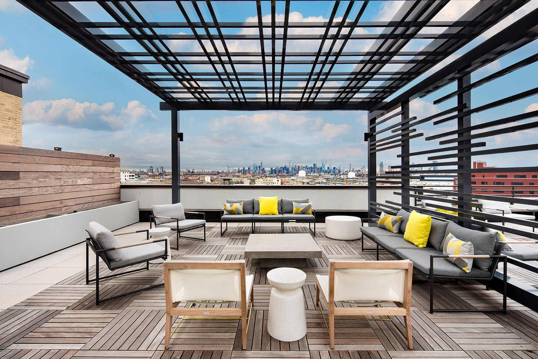 Rooftop with modern seating and decor with Manhattan skyline view